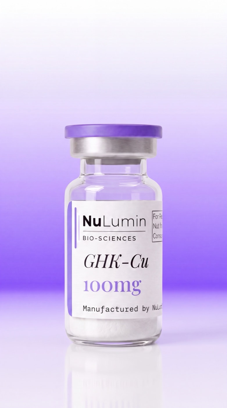 A sealed NuLumin vial standing upright, the freeze-dried cake settled in the base of the glass